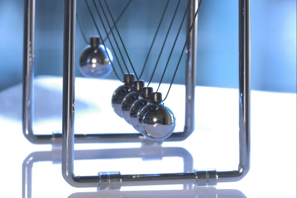 Newton's cradle on a table for physics
